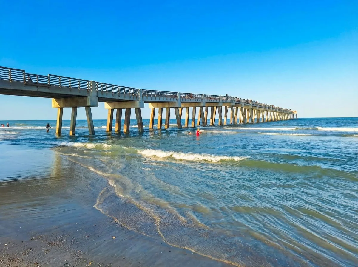 Jacksonville Beach Pier extending into the Atlantic Ocean on a clear day